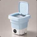 Order - اوردر blue compact folding washing machine with lid open, showing water and spinning mechanism. Ideal for small spaces.